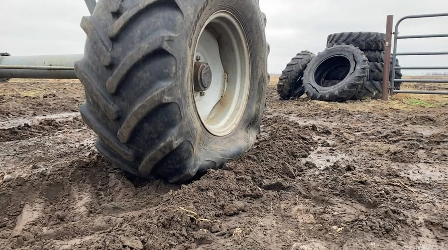 A diagram comparing the footprint and sidewall flex of a correctly inflated tire versus an underinflated one.