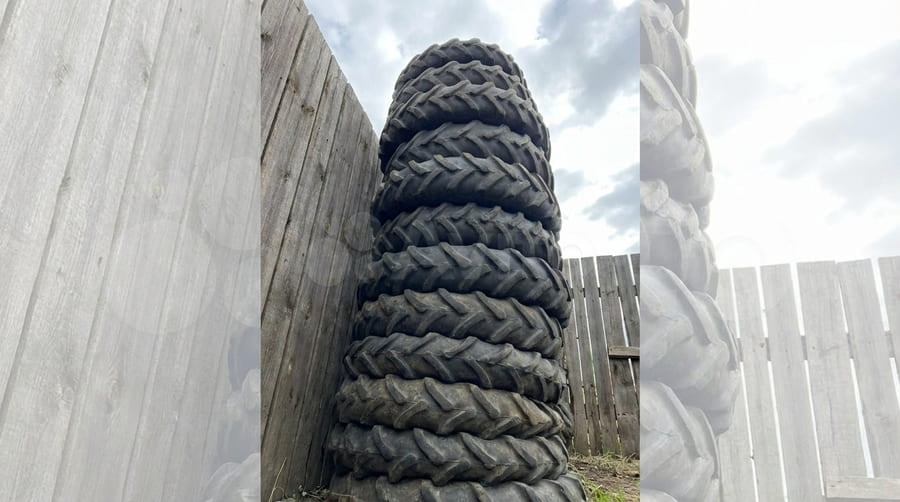 An example of tires stacked improperly in a high, leaning pile.