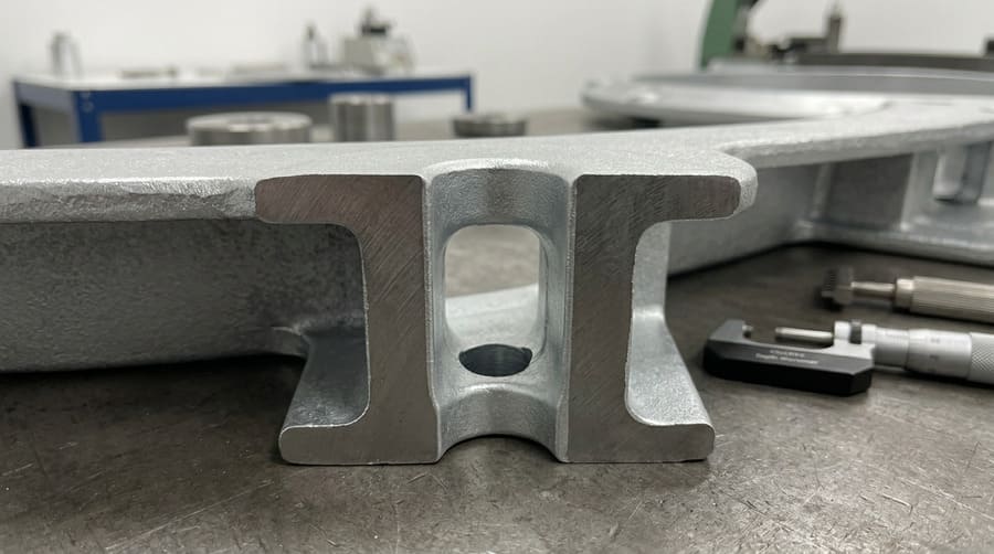 A cutaway view of a bolt hole on a rim, showing the uniform HDG coating inside and out.